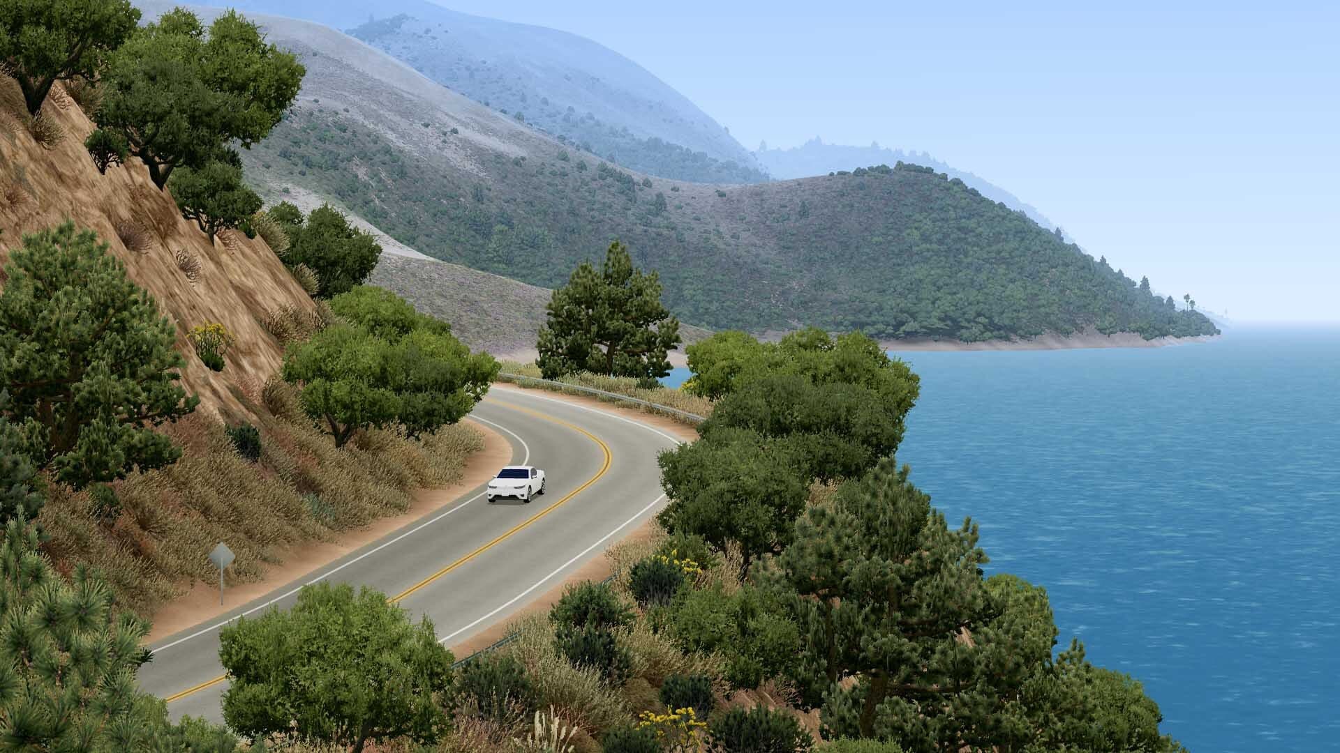 Slow Roads official screenshot of a lakeside mountain road